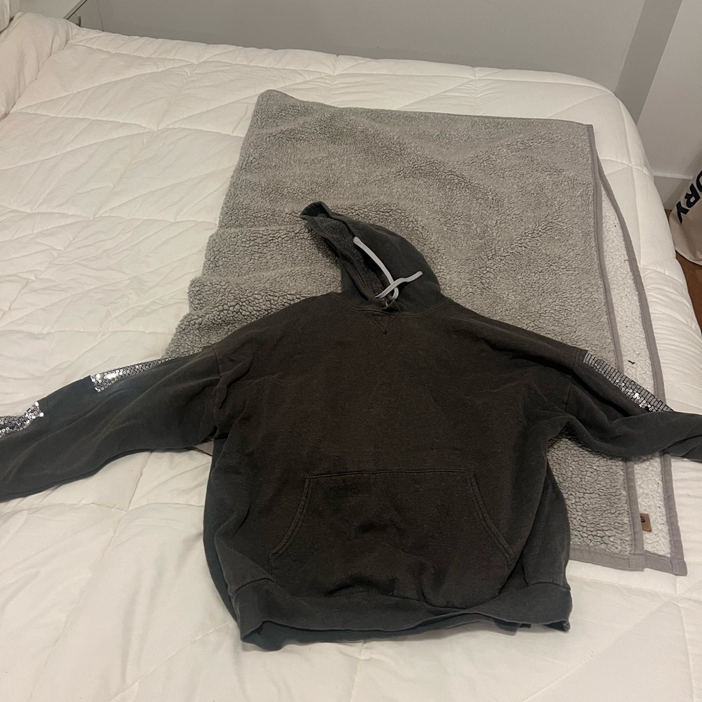Charcoal sweatshirt with sequins on sleeves.